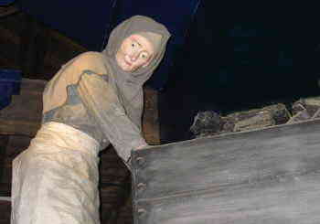 Display at the Yorkshire Mining Museum
showing a female miner pushing a coal truck female miner moving coal